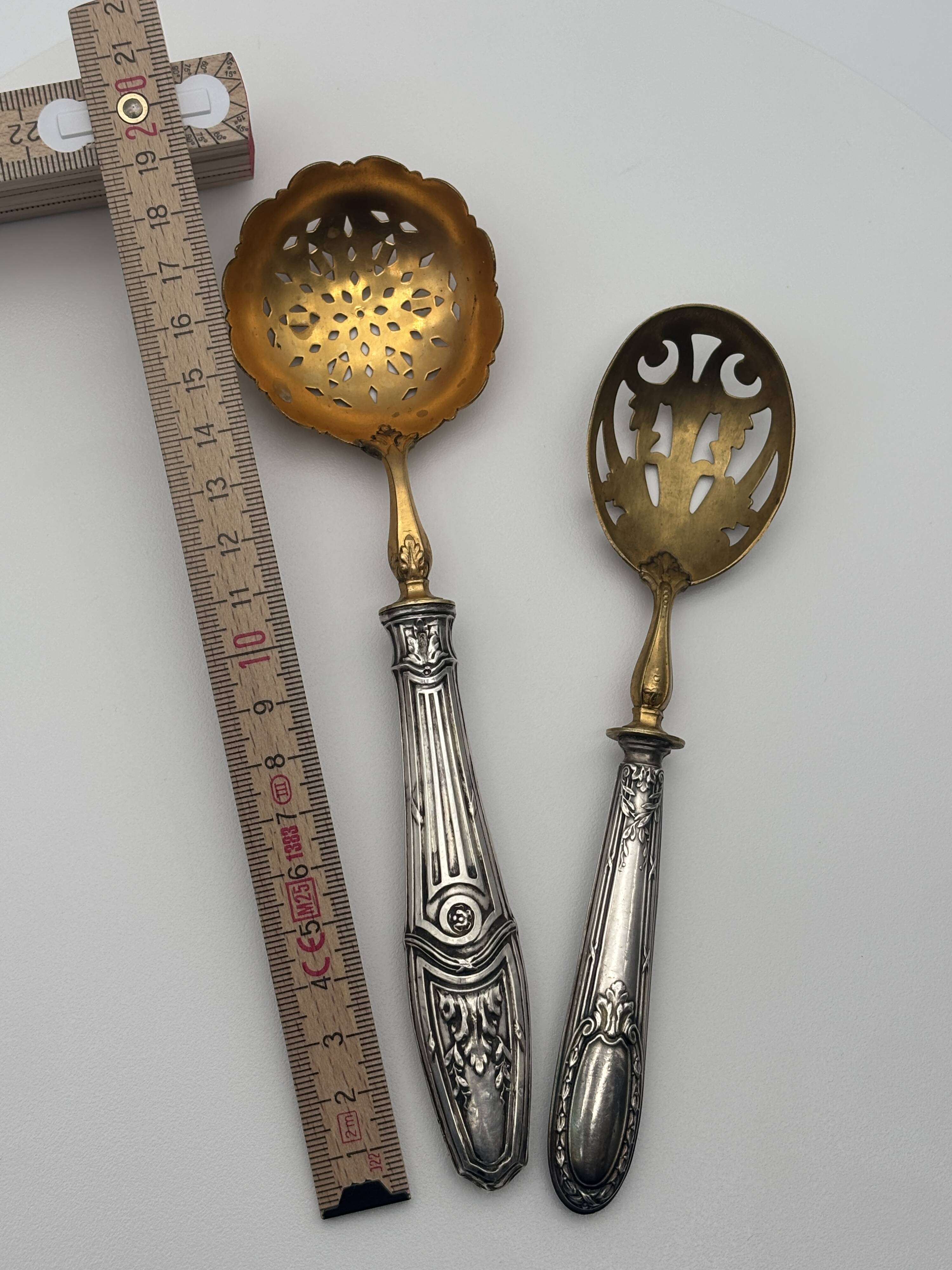 Pair of silver Minerva and vermeil shakers, 19th century.