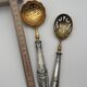 Pair of silver Minerva and vermeil shakers, 19th century.