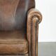 Armchair / lounge chair made of sheepskin leather with characterful patina