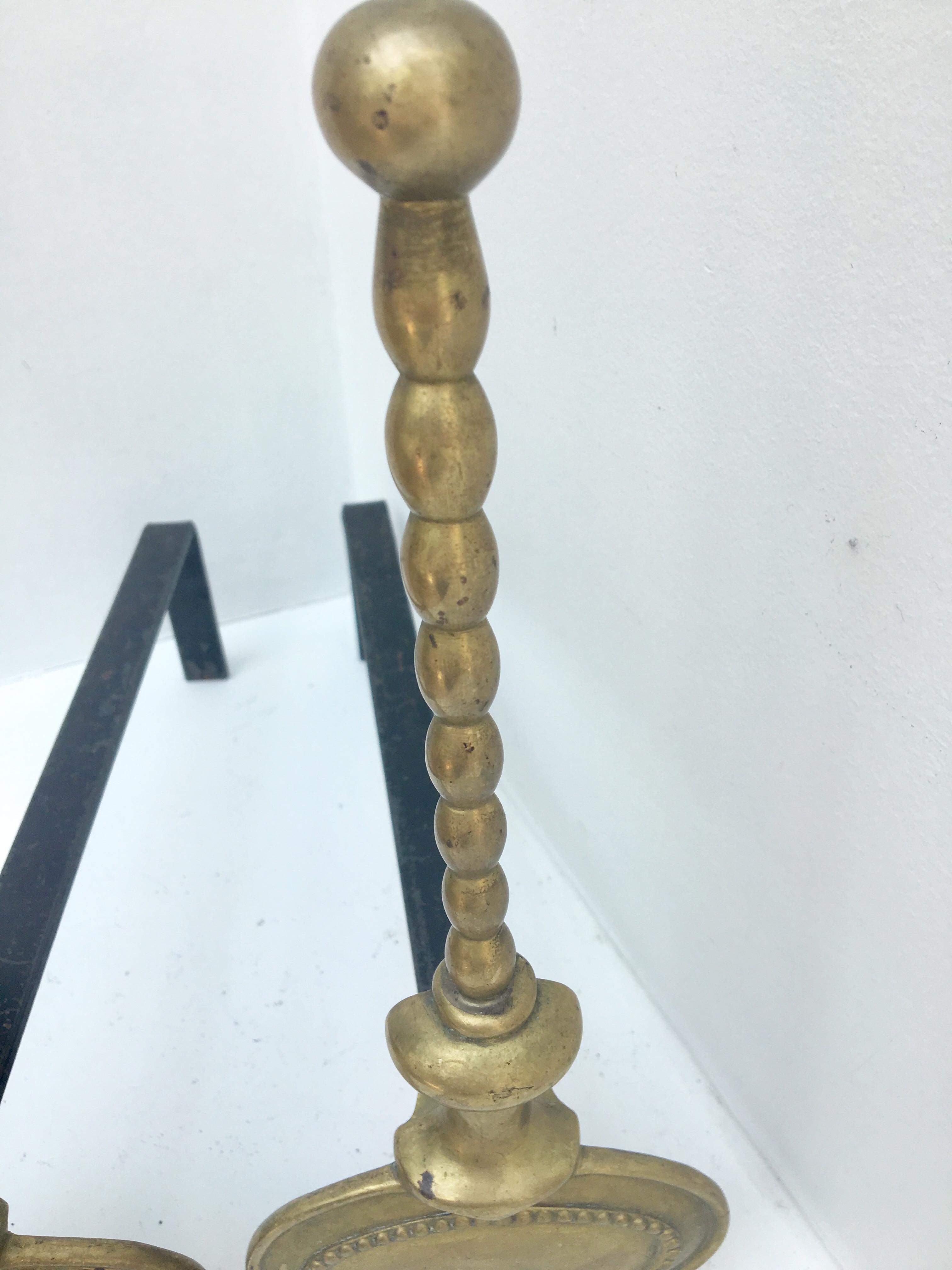 Pair of andirons in brass for fireplace
