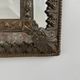Small mirror with brass parcloses in repoussé style Louis XIV, late 19th century.
