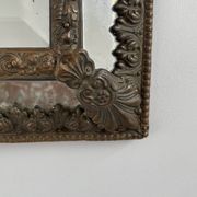 Small mirror with brass parcloses in repoussé style Louis XIV, late 19th century.