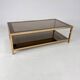 Belgo Chrome coffee table in brass and smoked mirror glass, 1970s.