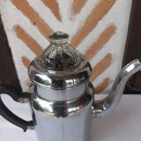 Silver metal coffee maker with glass cap