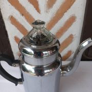 Silver metal coffee maker with glass cap