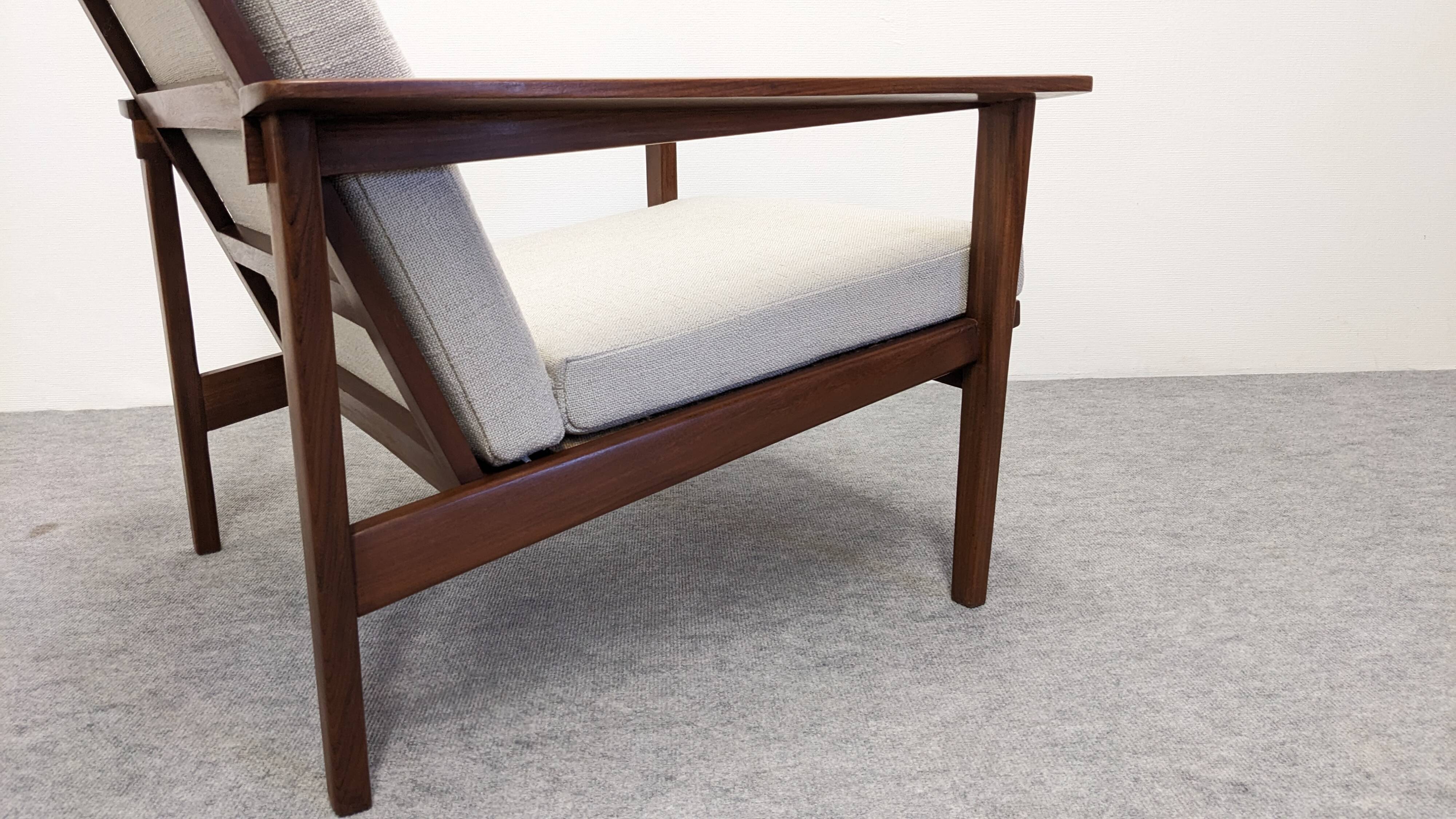 Pair of Scandinavian style armchairs in teak, France circa 1950.