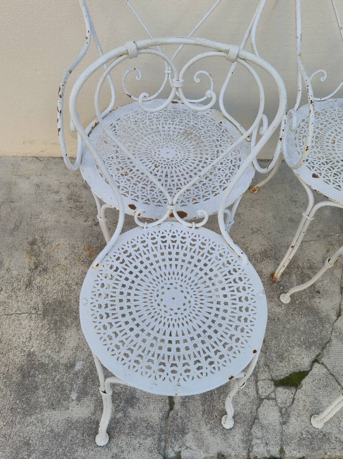 Garden furniture, two armchairs and two wrought iron chairs, period 1