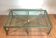 Important coffee table in patinated and gilded steel and wrought iron.