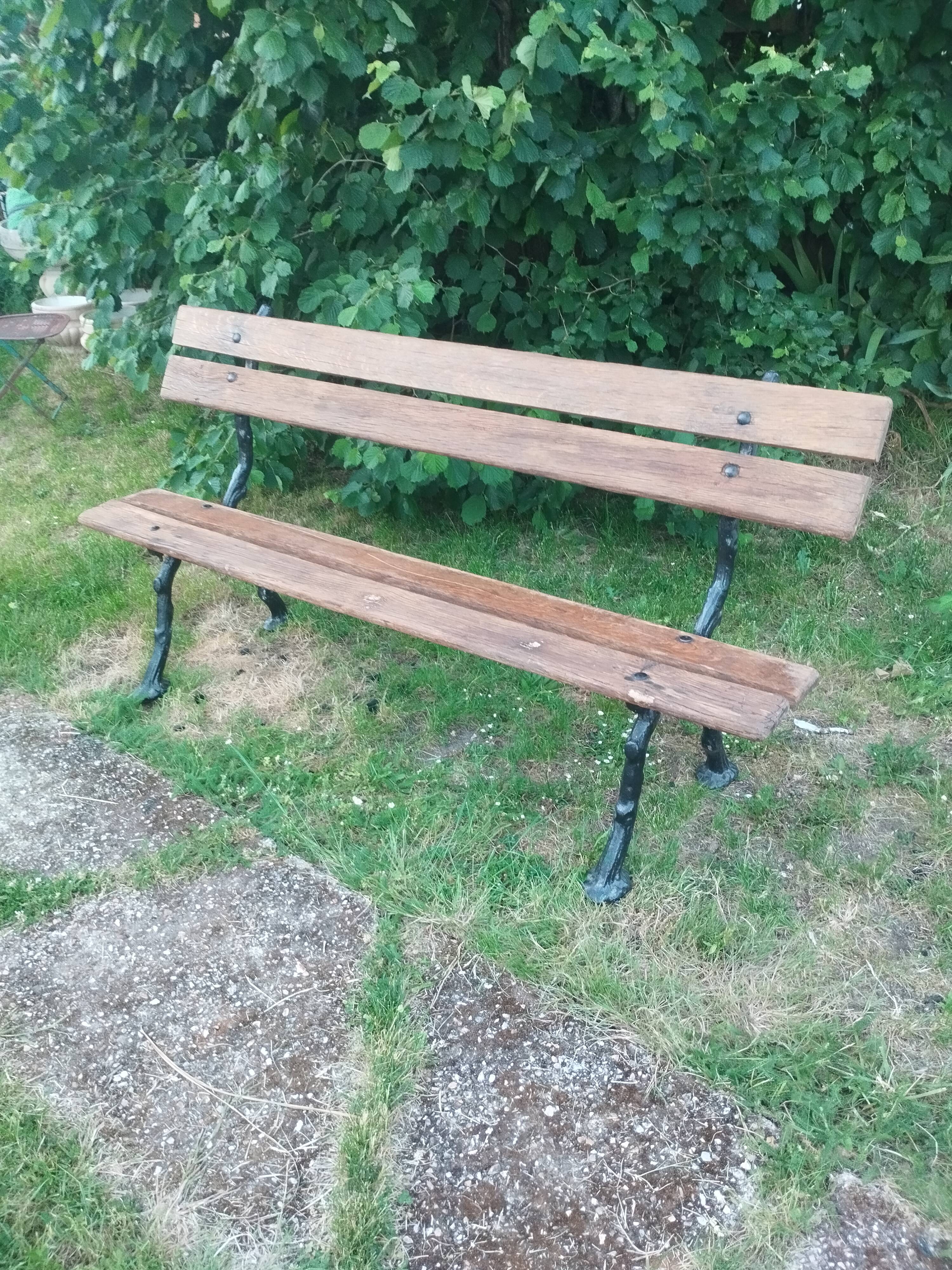 Antique garden bench with cast iron legs