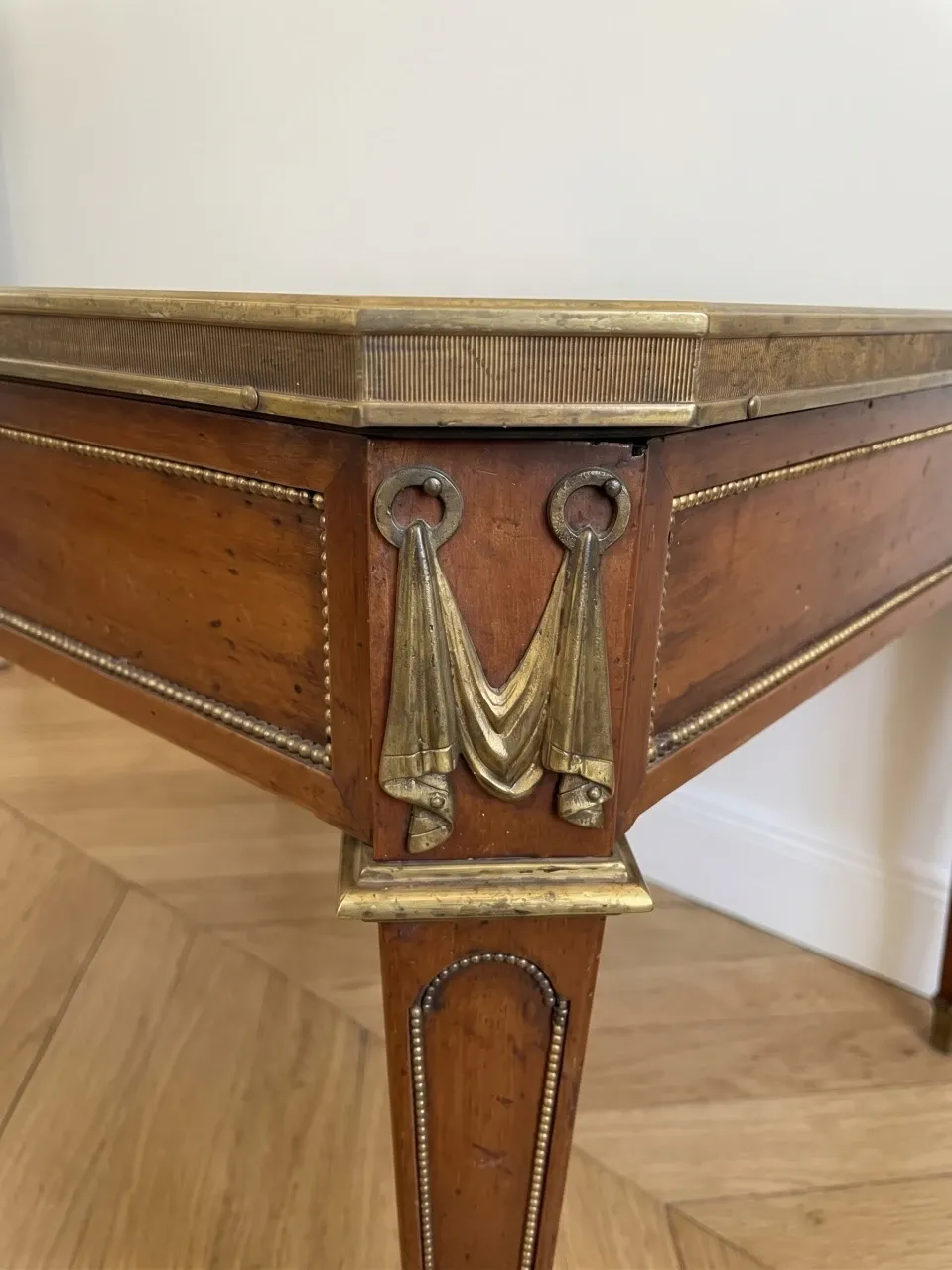 Louis XVI style coffee table in wood and marble with bronze ornaments.