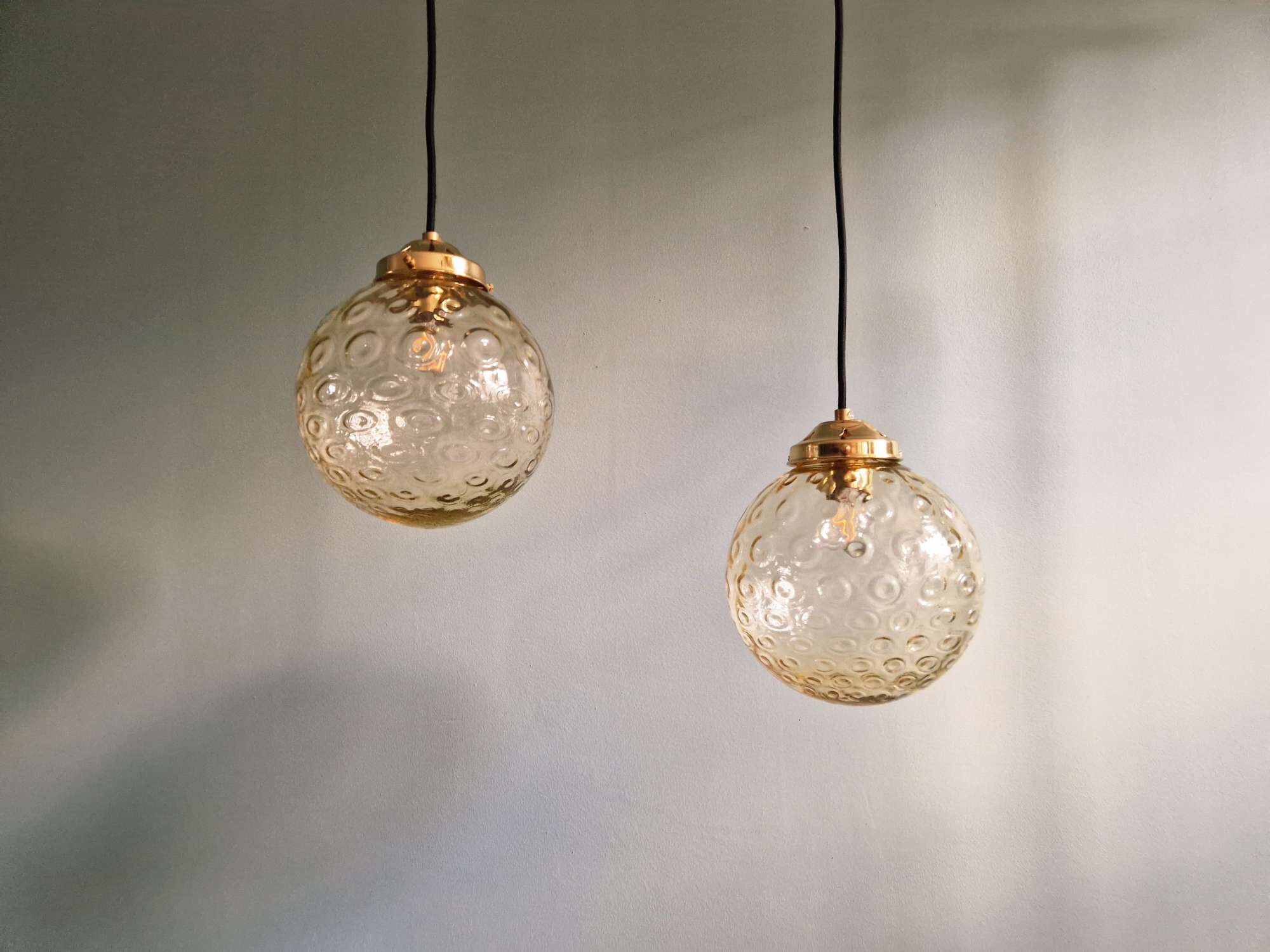 Pair of amber bubble glass pendant lights, 1970s