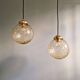 Pair of amber bubble glass pendant lights, 1970s