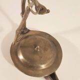 Old oil lamp in golden brass to hang