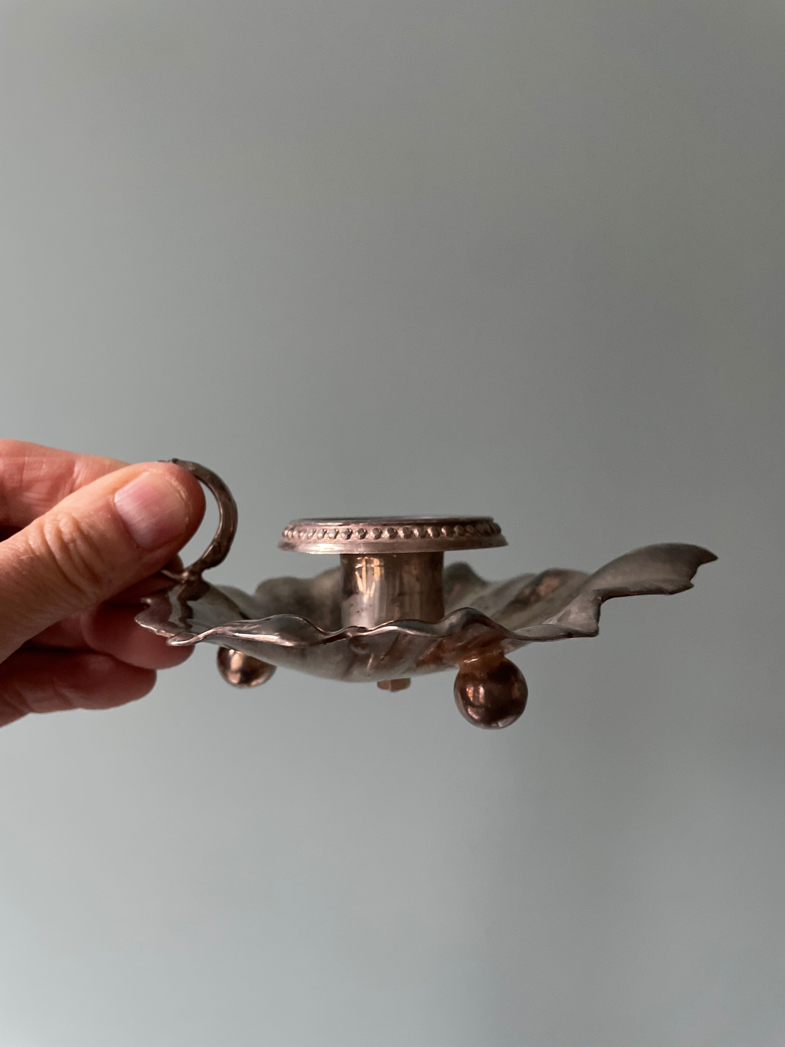 Old leaf-shaped hand candle holder, mid-twentieth
