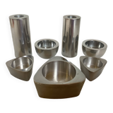 Seven different metal candle holders
