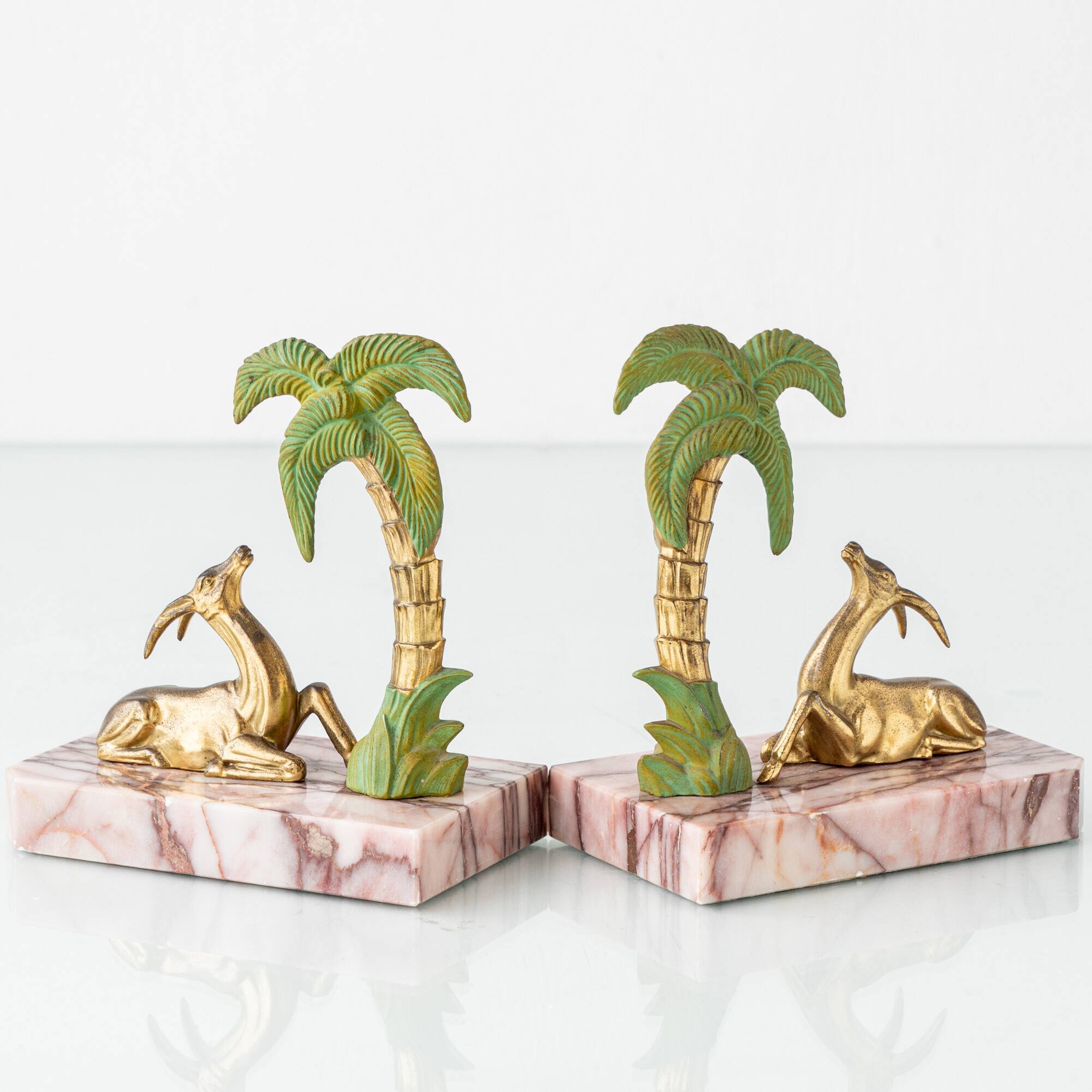 Pair of Art Deco Bookends in Pink Breccia Marble with Antelope and Palm Tree