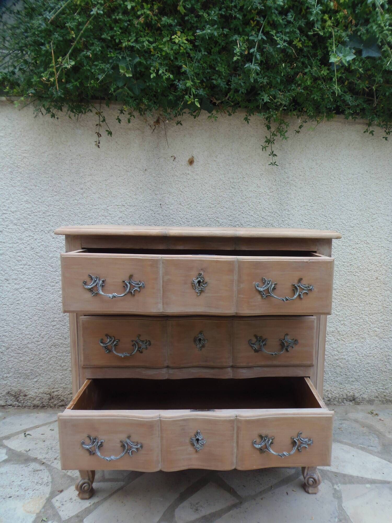 Beautifully crafted Louis XVI style commode in bleached wood.