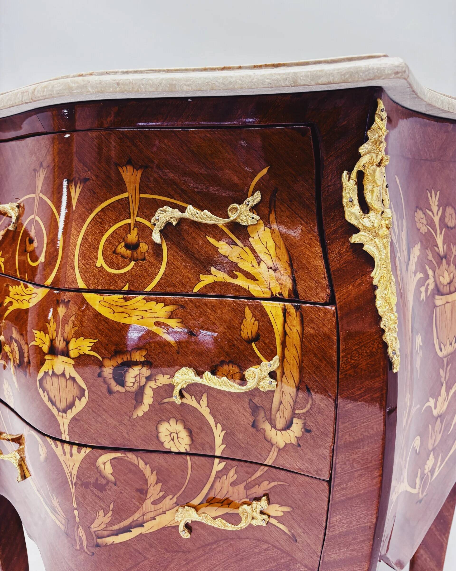 Marquetry chest of drawers with marble top in Louis XV style