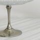 Bowl on a foot in worked glass and elegant metal