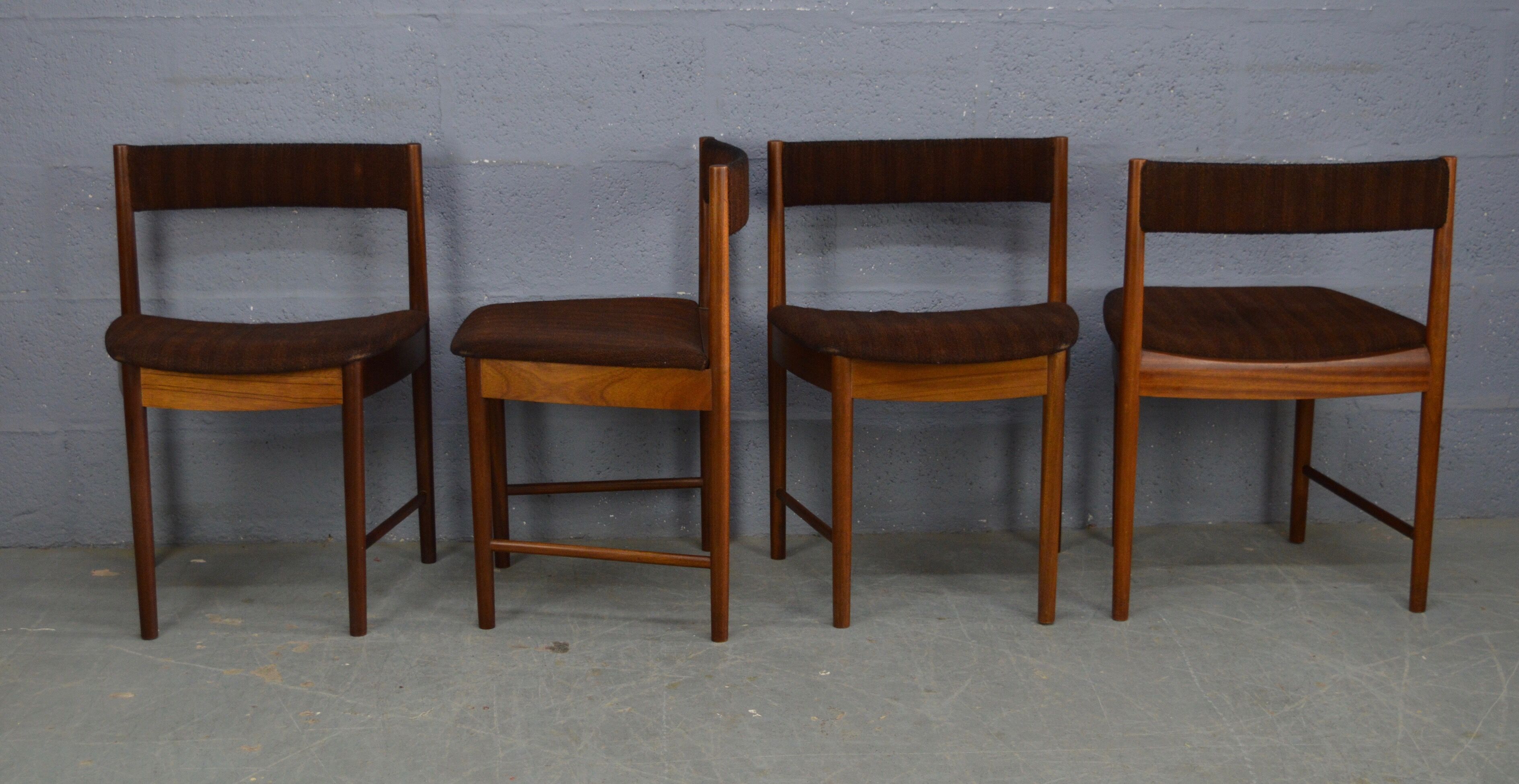 Round teak dinning table and chairs by Mctintosh