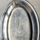 Oval silver-plated metal dish monogrammed "EM"