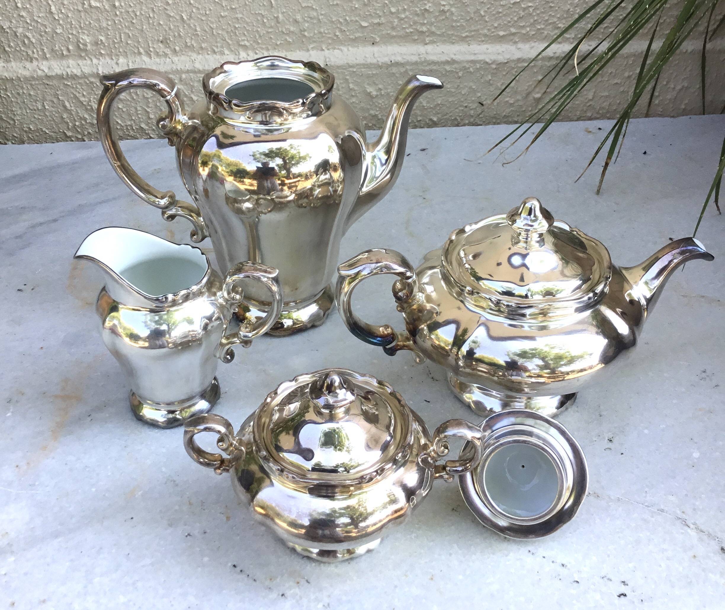 Tea and coffee service in porcelain and silvered enamel.