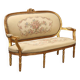 Neoclassical canapé in gilded wood