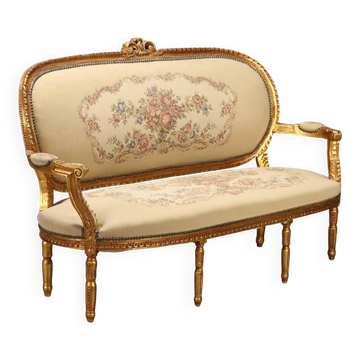 Neoclassical canapé in gilded wood