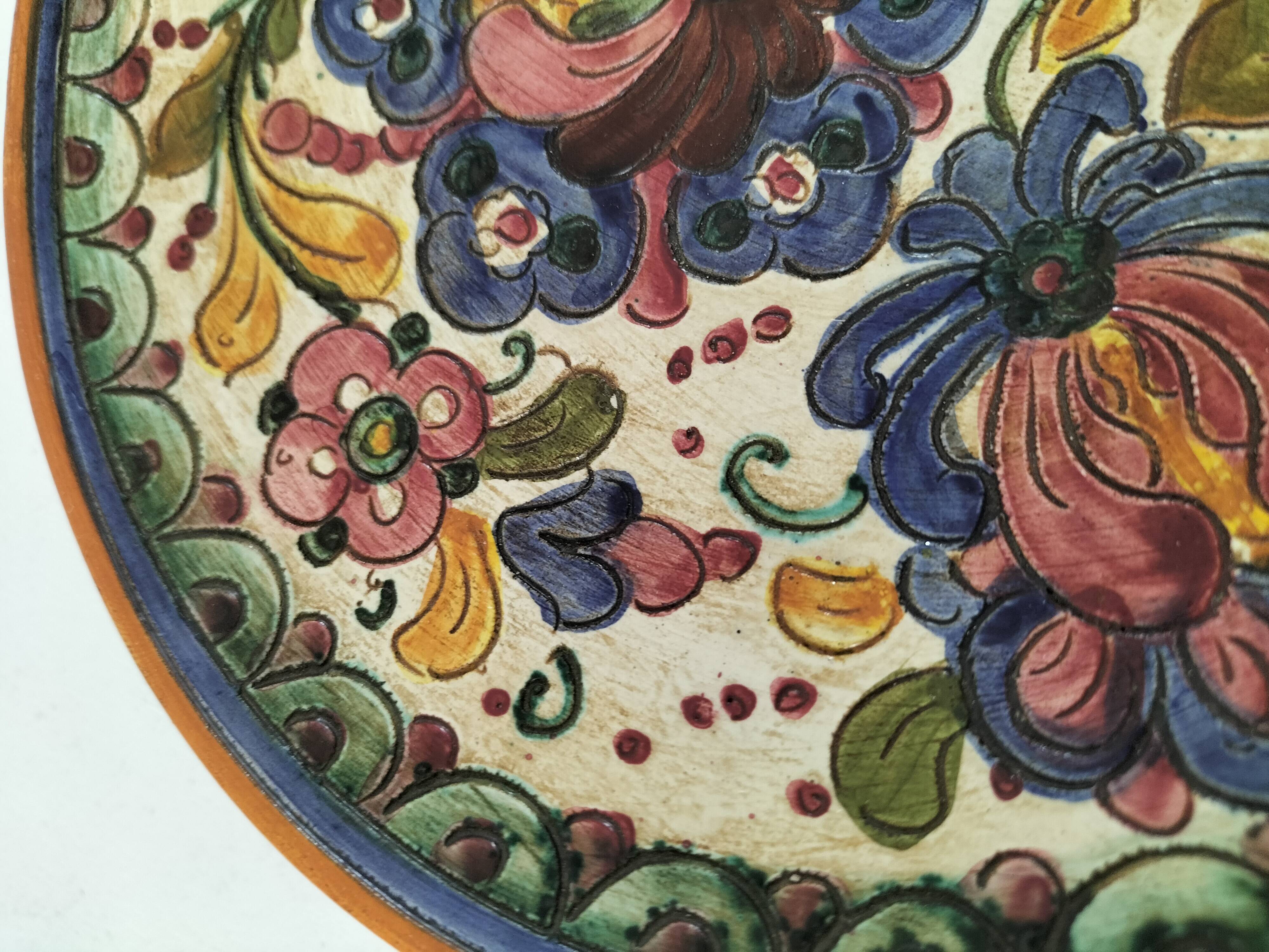 Spanish earthenware plate, hand-painted floral decoration.