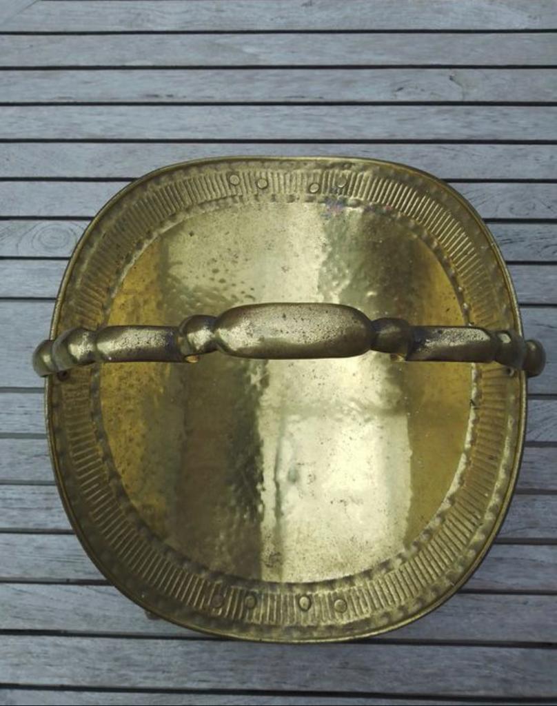 Old brass log holder