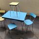 Vintage set from the 60s/70s: table, chairs, and marbled Formica stools.