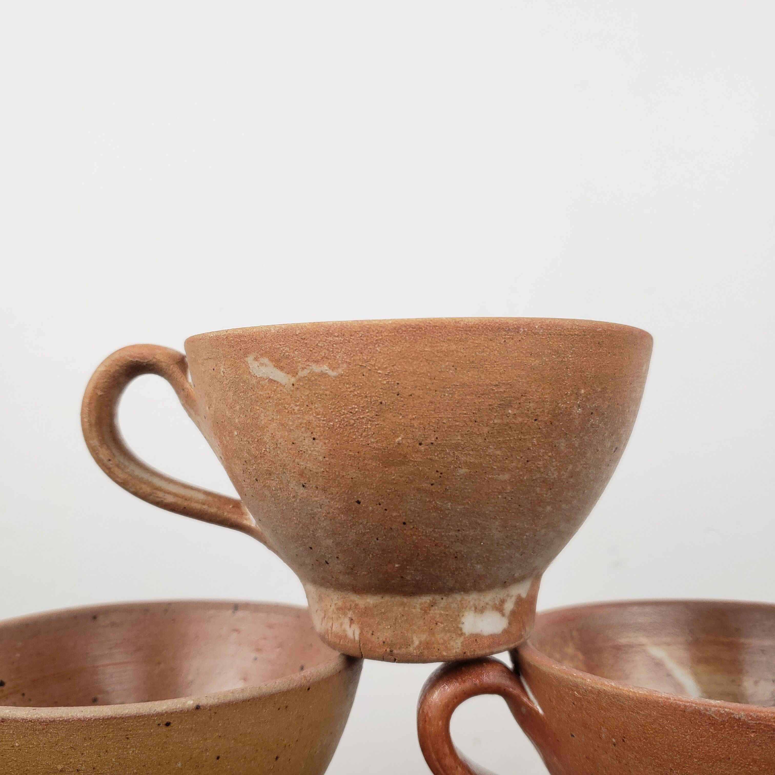 "Bowled" stoneware cups