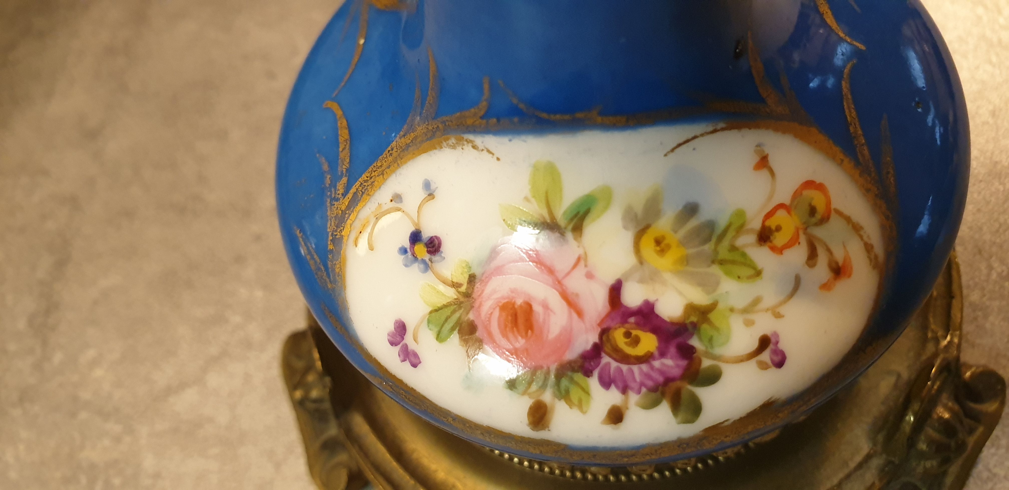 Pair of xixth candle holders, in bronze and enamelled porcelain