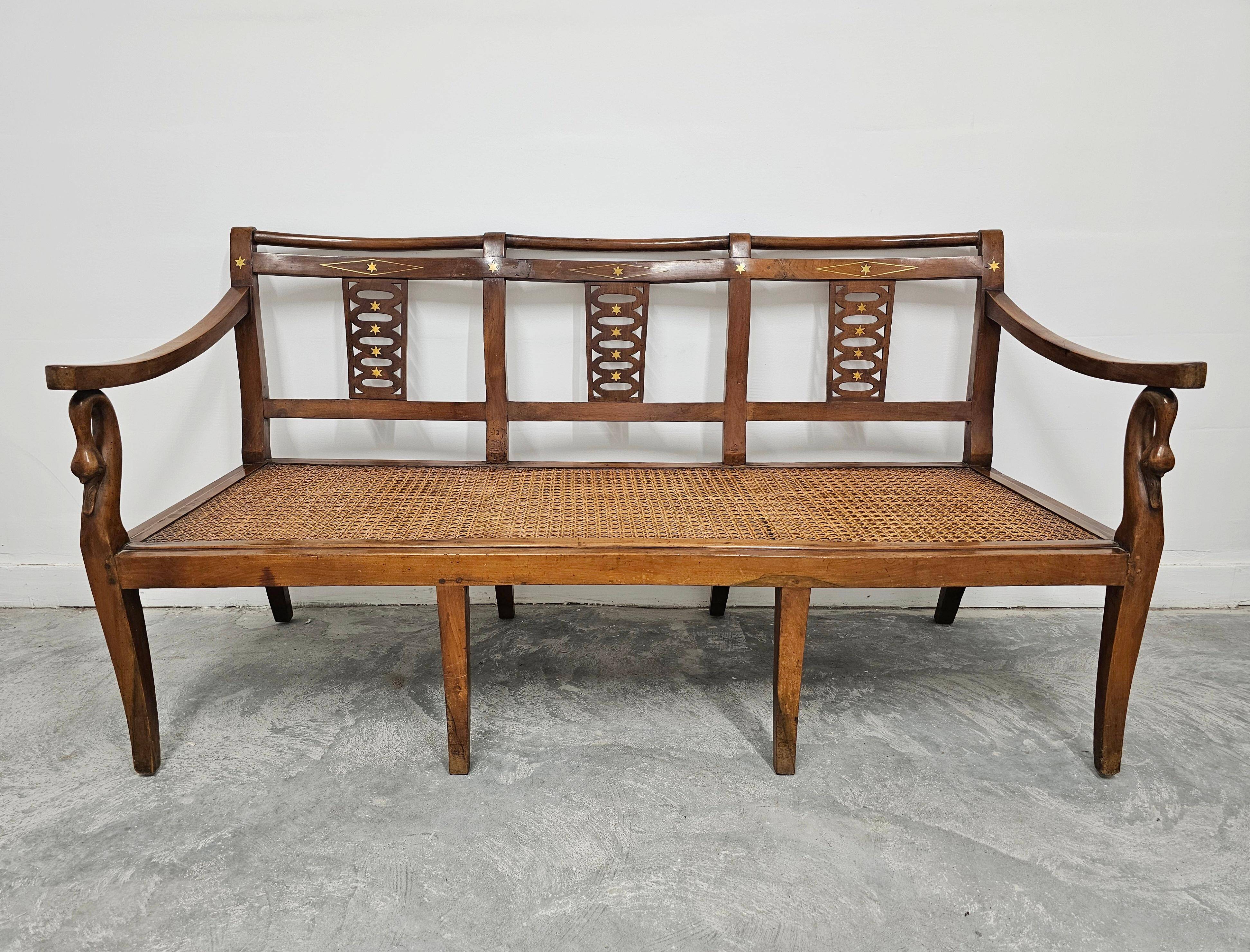 Directoire canapé in walnut with brass inlays, late 18th century.
