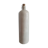 Old bottle in sandstone