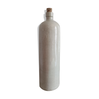 Old bottle in sandstone