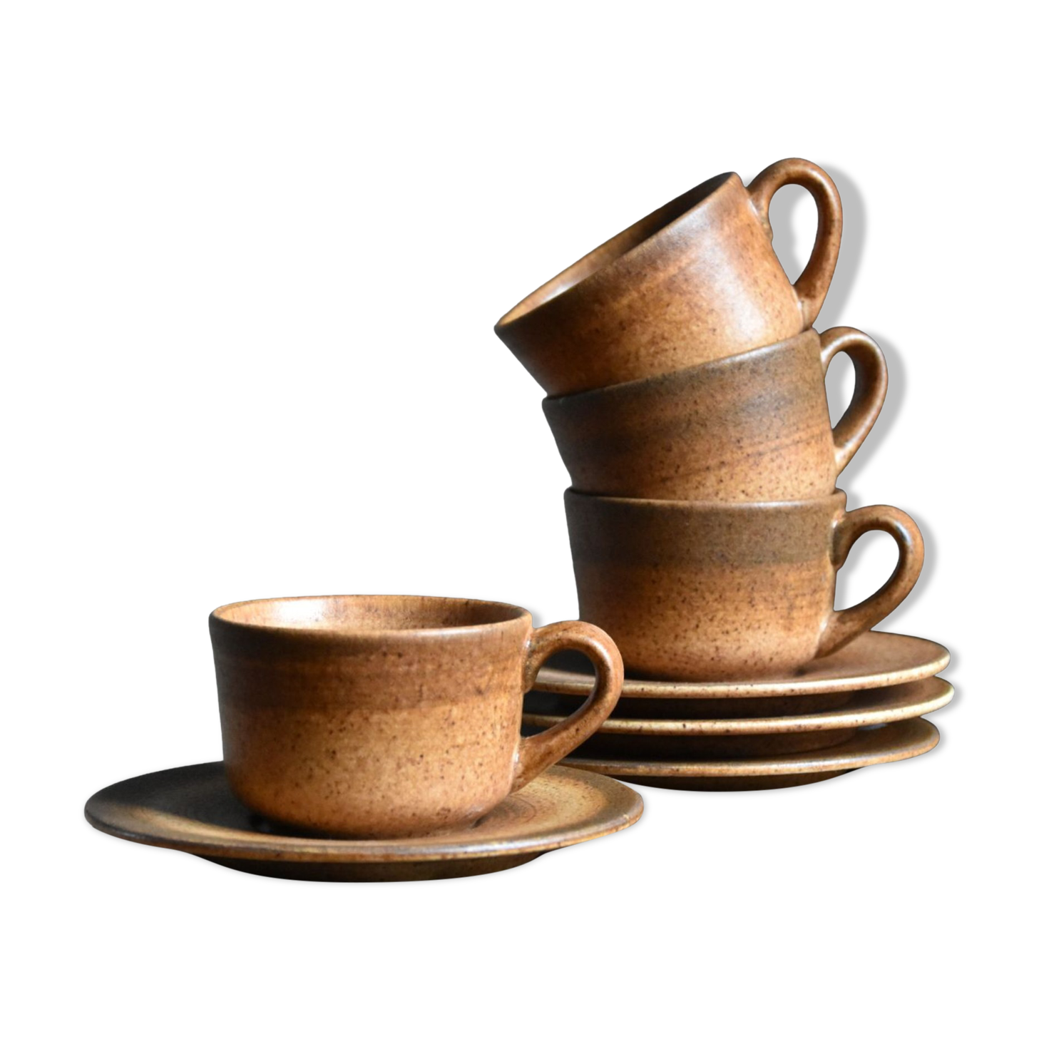 4 sandstone cups and saucers