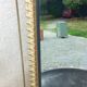 Vintage 1950s neoclassical style gold metal mirror