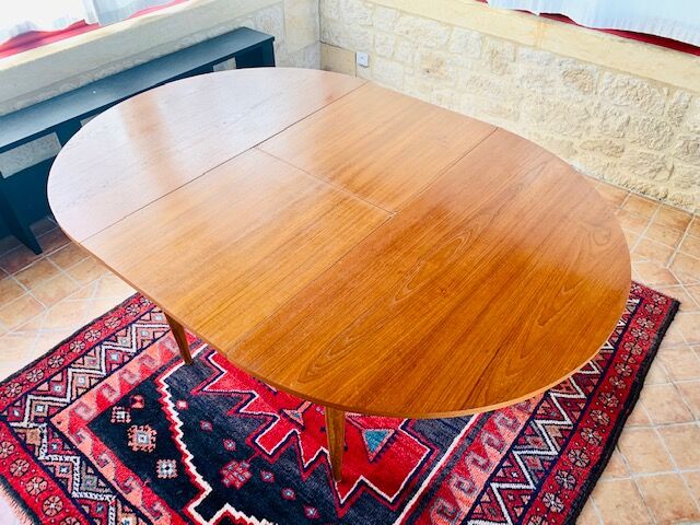 Expandable teak dining table, butterfly extension, circa 60s