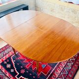 Expandable teak dining table, butterfly extension, circa 60s