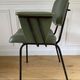 Vintage chair with green imitation leather armrests