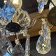 Three-light chandelier in bronze and cut crystal, early 20th century work.