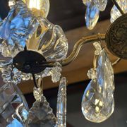 Three-light chandelier in bronze and cut crystal, early 20th century work.