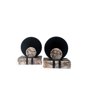 Art Deco bookends with a circular design in black and pink marble.