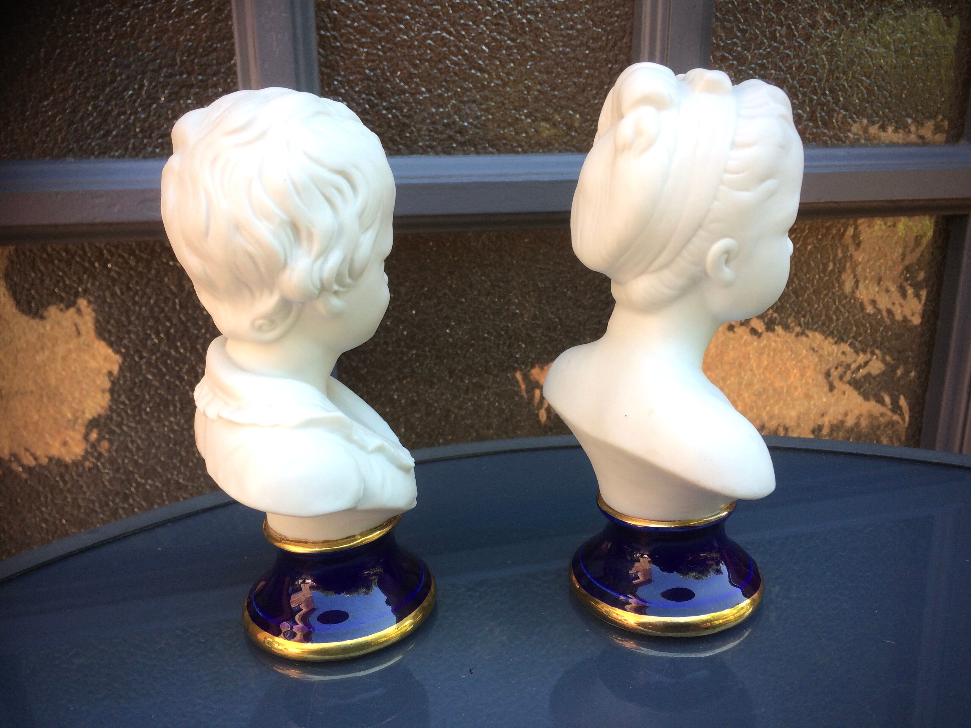 Children's busts in biscuit