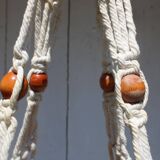 Hanging plant holders in macramé and rattan