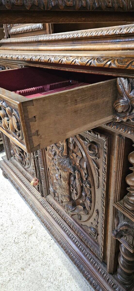 Two-body buffet in solid oak, richly carved in the Renaissance style.