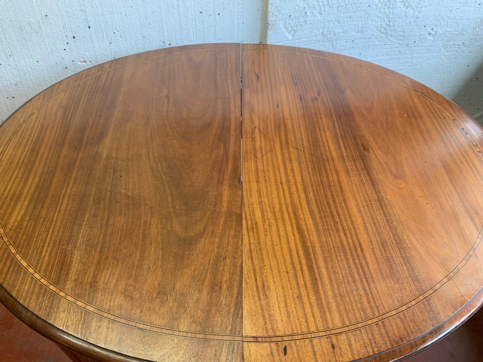 Louis XVI style table in mahogany and light wood 20th century