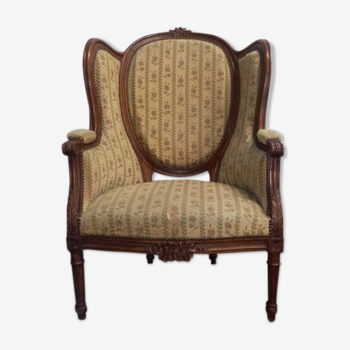 Fauteuil bergère médaillon Louis XVI en noyer tissus en petit point de croix