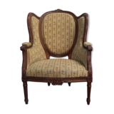 Fauteuil bergère médaillon Louis XVI en noyer tissus en petit point de croix
